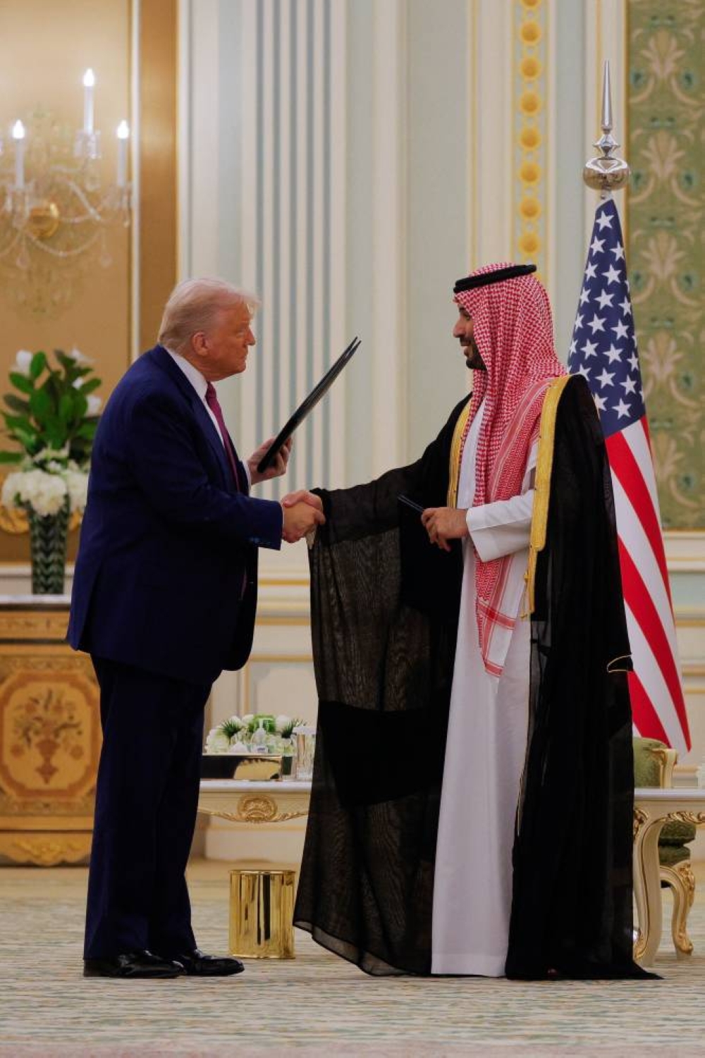 US President Donald Trump and Saudi Crown Prince and Prime Minister Mohammed Bin Salman shake hands during a Memorandum of Understanding (MOU) signing ceremony at the Royal Court in Riyadh, Saudi Arabia, on Tuesday. REUTERS