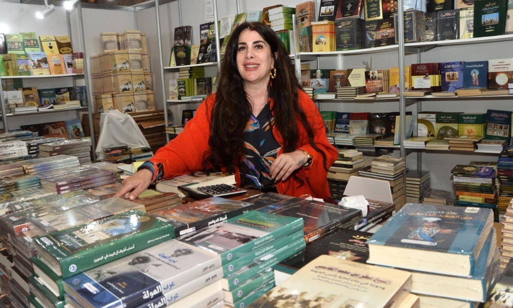 Ban Khaled al-Ani presenting Arab Encyclopedia House's new publications