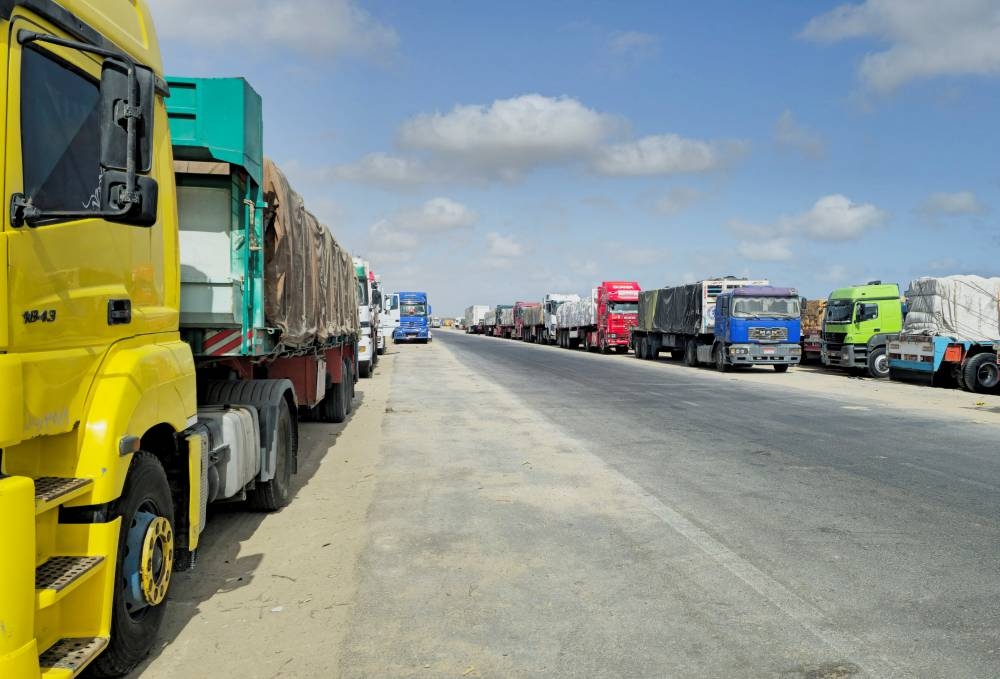 Trucks loaded with humanitarian aid for Gaza continue to wait in Al Arish to enter through the borders, in the North Sinai city of Al Arish, Egypt, on Monday. REUTERS