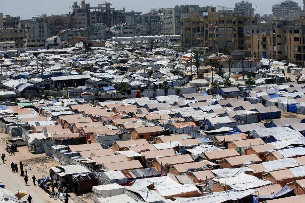 Palestinians displaced by the Israeli military offensive, shelter in tents, in Gaza City, on Tuesday. REUTERS