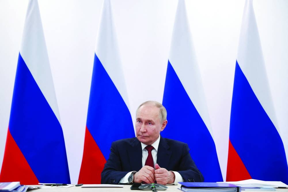 Russian President Vladimir Putin chairs a meeting of the Board of Trustees of the Talent and Success Foundation as he visits the Sirius educational centre near Sochi in the Krasnodar region on Monday. (Reuters) 