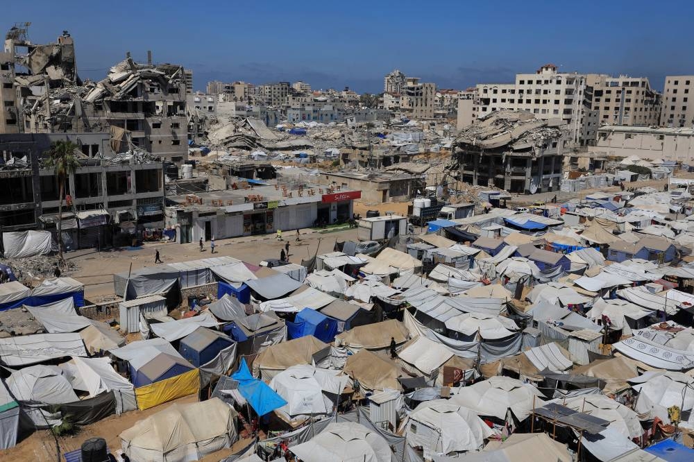 Palestinians displaced by the Israeli military offensive, shelter in tents, in Gaza City, on Friday. REUTERS