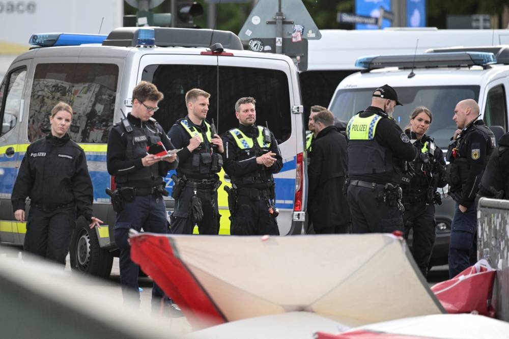 Police officers gather at Hamburg's main train station, after several people were injured in a knife attack, in Hamburg, Germany, Friday. REUTERS