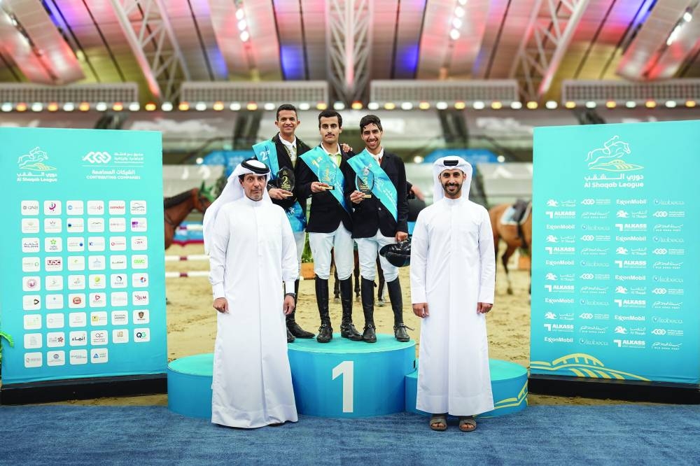 Young Champions category winner Saif Mohammed al-Naimi, runner-up Abdulaziz Fahad al-Eid and third-placed Yaqoub Nasser Almas pose on the podium with their trophies. Mohammed Hamza al-Kuwari, Director of Corporate Services at Al Shaqab, presented the awards, with tournament director Khalid Sanad al-Nuaimi also seen in the picture.