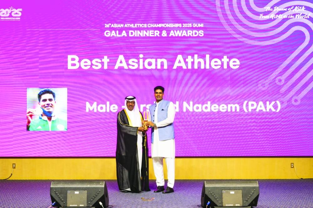 Asian Athletics Association (AAA) president Dahlan Jumaan al-Hamad is seen with Pakistan's Arshad Nadeem who won the gold medal at last year's Olympic Games in Paris. Nadeem won the Best Athlete of Asia award at the Gala Dinner and Awards ceremony held on the sidelines of the 26th Asian Athletics Championships 2025 in Gumi, Korea.