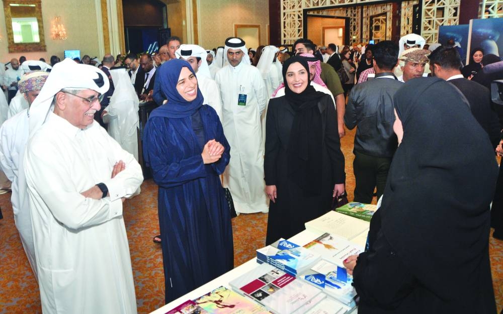 HE Dr Hamad bin Abdulaziz al- Kawari, HE Lolwah bint Rashid bin Mohammed AlKhater and HE Maryam bint Abdullah al-Attiyah touring booths at the conference.