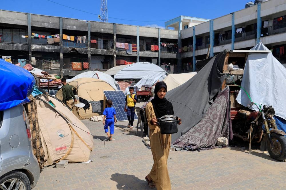 Palestinians, displaced by the Israeli military offensive, shelter in a UNRWA school, in Khan Younis in the southern Gaza Strip, on Wednesday. REUTERS