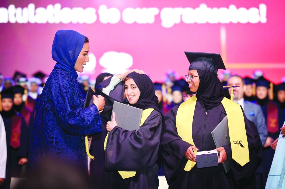 Her Highness Sheikha Moza interacts with graduates at the ceremony. PICTURE: AR Al-Baker