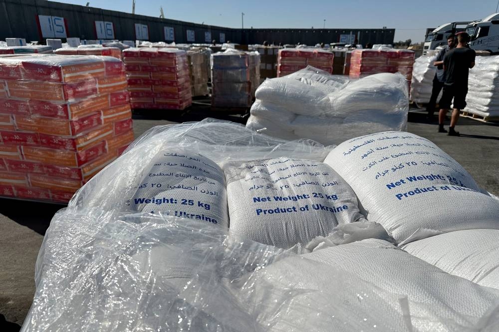 Supplies wait to be loaded on trucks to go into the Gaza Strip, at the Kerem Shalom crossing between Israel and Gaza, on its Israeli side, on Thursday. REUTERS