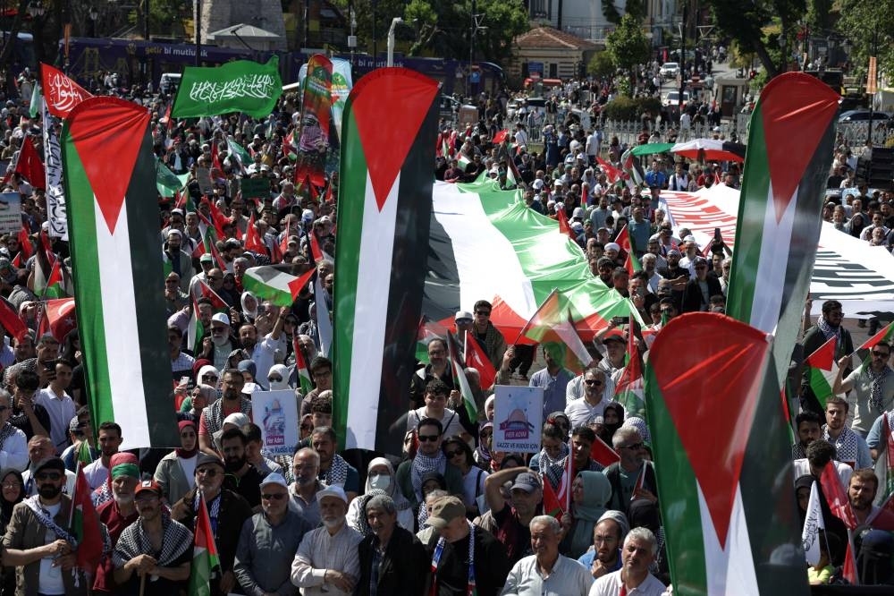 Pro-Palestinian demonstrators take part in a rally to mark the 15th anniversary of the Mavi Marmara Gaza flotilla incident in Istanbul, on Sunday.