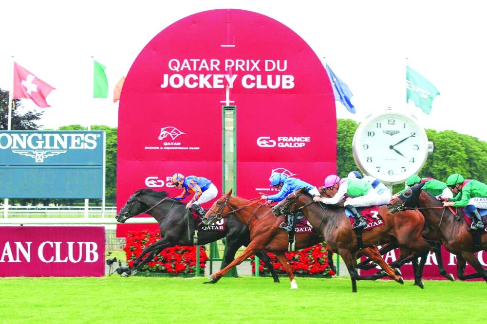 Jockey Ryan Moore guided Camille Pissarro to QREC-sponsored Qatar Prix du Jockey Club victory at Chantilly, France.
