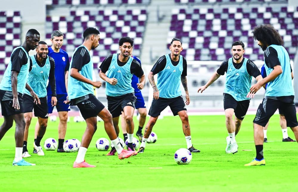 Qatar players train at the Jassim Bin Hamad Stadium in Doha on Wednesday, on the eve of the World Cup qualifying match against Iran. PICTURES: Noushad Thekkayil