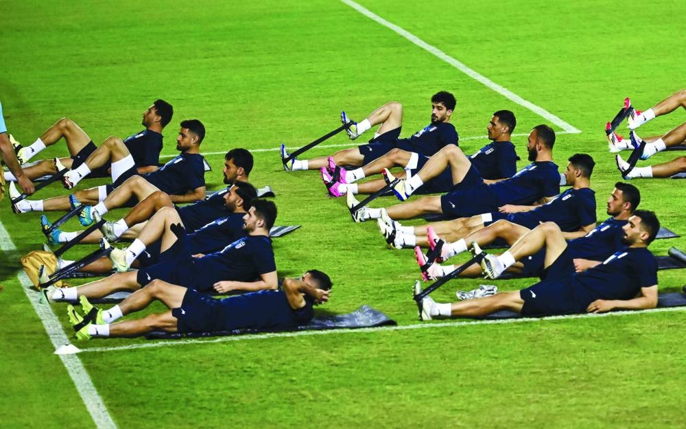 Iran, who have already qualified for their fourth consecutive World Cup, warm up before a training session in Doha on Wednesday.