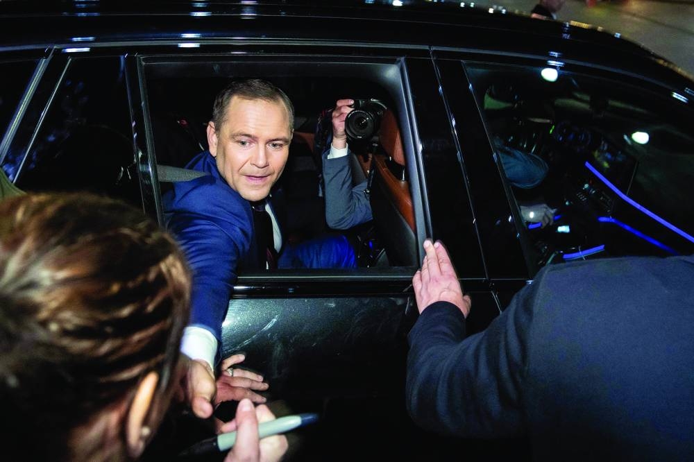 
President-elect Karol Nawrocki greets his supporters gathered in front of the Presidential Palace in Warsaw as he leaves after meeting with Poland’s President Andrzej Duda. (AFP) 