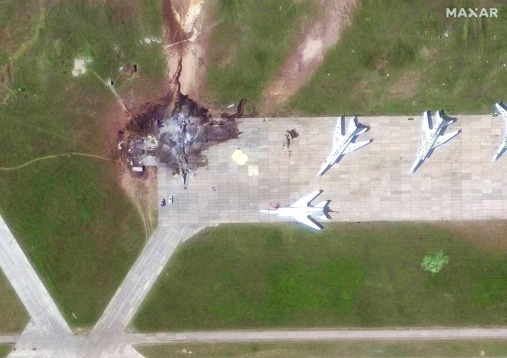 
A satellite image shows a destroyed TU 22 aircraft in the aftermath of a drone strike at the Belaya air base, Irkutsk region, Russia, on June 4, 2025. (Reuters) 