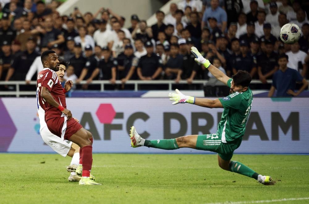 Soccer Football - World Cup - AFC Qualifiers - Group A - Uzbekistan v Qatar - Milliy Stadium, Tashkent, Uzbekistan - June 10, 2025 Uzbekistan's Dor Shomurodov scores their second goal REUTERS/Maxim Shemetov