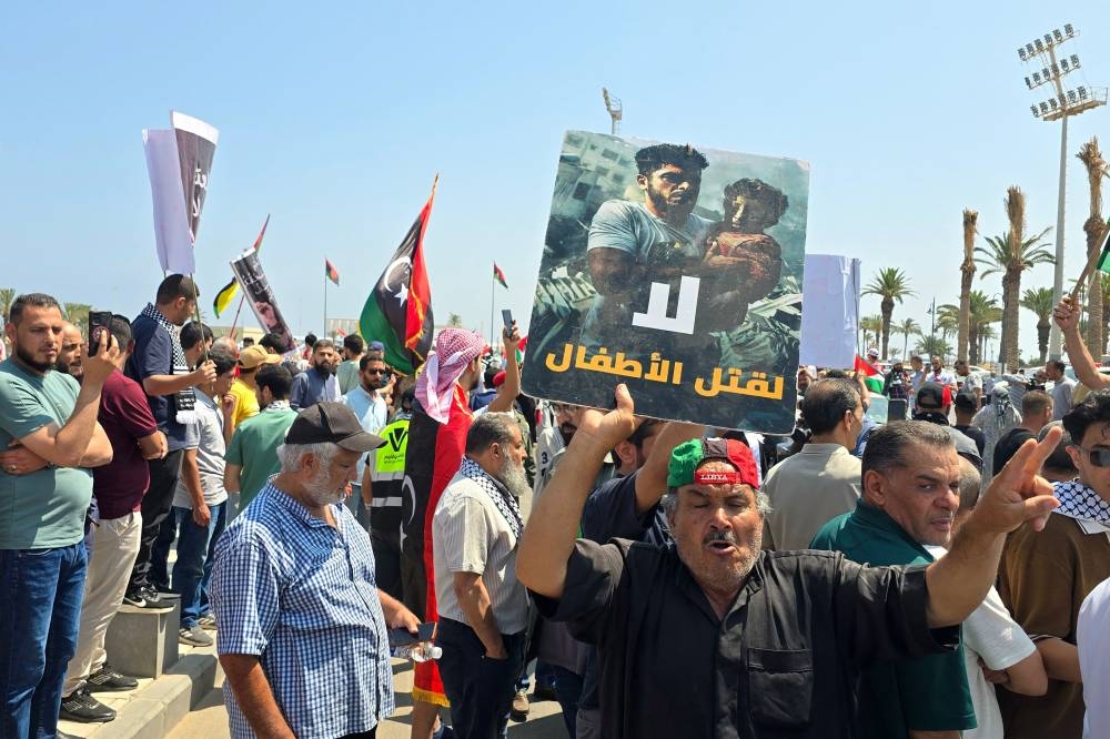 Activists, heading towards Gaza by land with the aim of breaking the siege on the Palestinian territory, are greeted by Libyans in Tripoli's Martyrs Square on Wednesday, one day after crossing into Libya from Tunisia. AFP