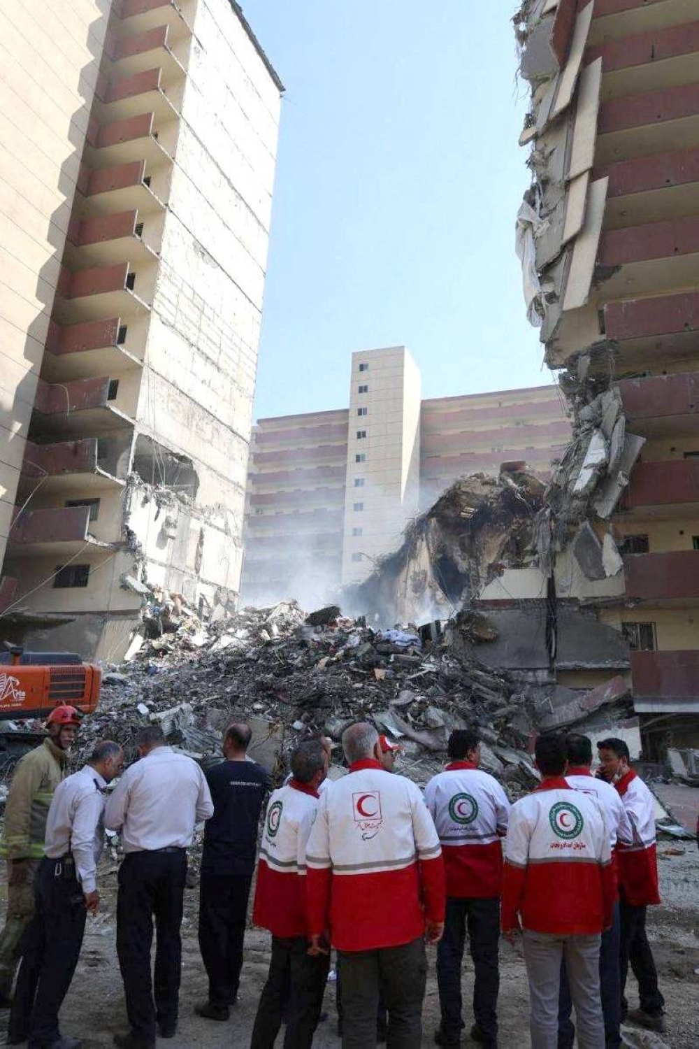 Rescuers work at the site of a damaged building, in the aftermath of Israeli strikes, in Tehran, Iran, on Friday. Iranian Red Crescent Society/WANA/Handout via REUTERS