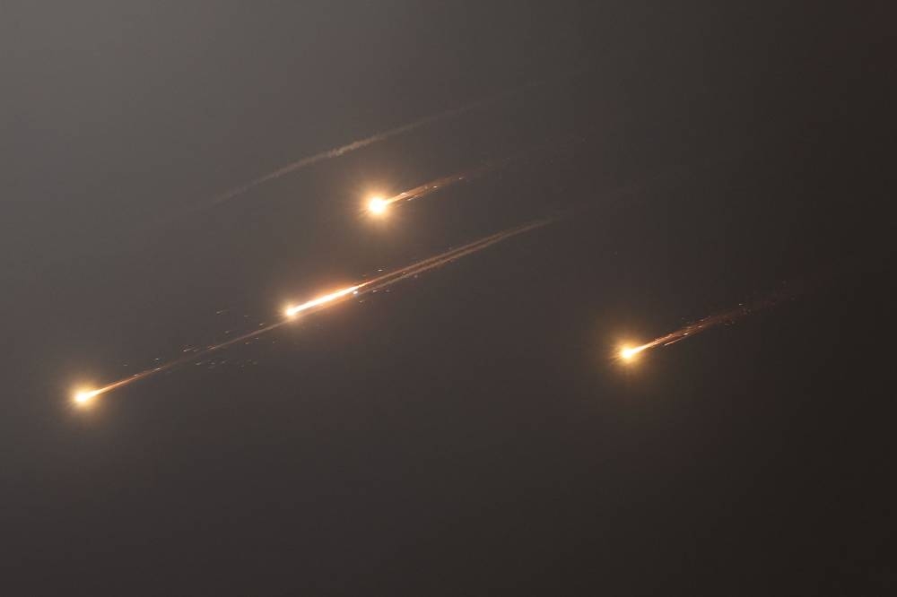 This picture shows rocket trails in the sky above Jerusalem on Friday. AFP