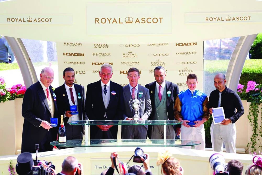 Ali bin Yousef al-Kubaisi, Ali bin Yousef al-Romaihi and Oliver Tait received the trophy on behalf of Wathan Racing.