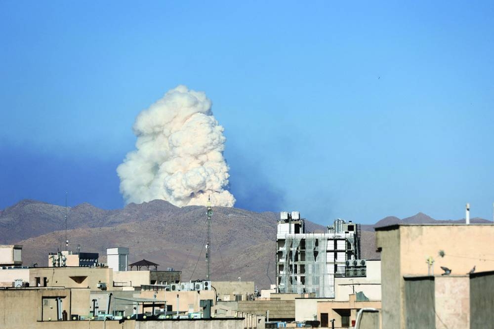 
Smoke rises following an Israeli attack in Tehran, Iran, yesterday.(Reuters) 