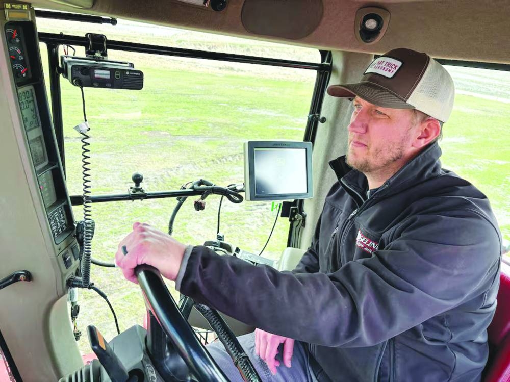 
Farmer Scott Huso of Aneta, North Dakota, sits in his tractor in early May, preparing to plant spring wheat once his fields are dry. (Reuters) 