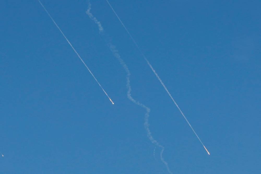 Missiles launched from Iran towards Israel are seen from Tubas, in the Israeli-occupied West Bank, on Sunday. REUTERS