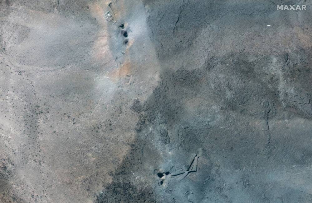 A closer satellite view shows holes and craters on a ridge at Fordow underground complex, after the US struck the underground nuclear facility, near Qom, Iran June 22, 2025.  MAXAR TECHNOLOGIES/Handout via REUTERS