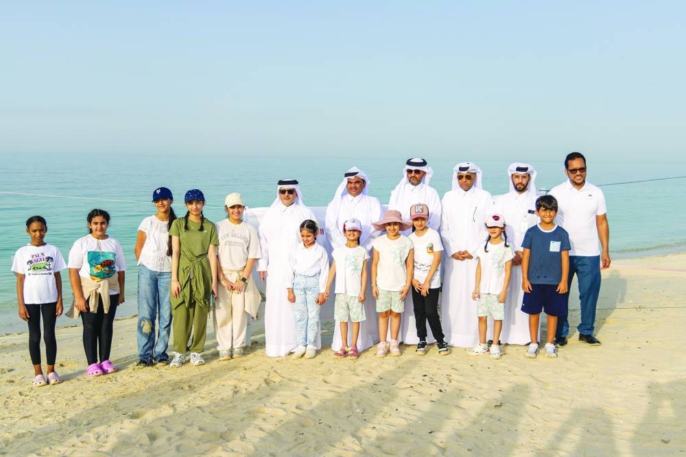 HE the Minister of Environment and Climate Change Dr Abdullah bin Abdulaziz bin Turki al-Subaie and officials with schoolchildren during the event.