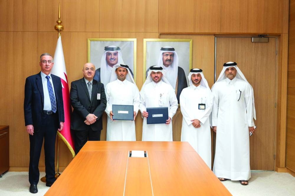 Officials at an agreement signing ceremony
