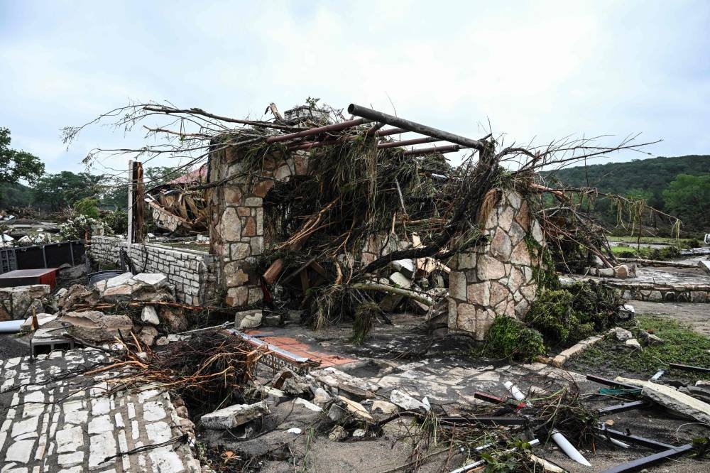 A damaged home is seen near Camp Mystic, the site of where at least 20 girls went missing after flash flooding in Hunt, Texas, on Friday.