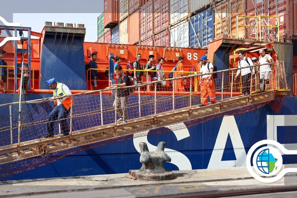 People disembark the MV Safeen Prism after the vessel picked up crew members of the MV Magic Seas bulk carrier, who were forced to abandon ship after an attack that the Houthis claimed responsibility for, at the port in Doraleh, Djibouti, Monday. DJIBOUTI PORTS & FREE ZONES AUTHORITY/Handout via REUTERS