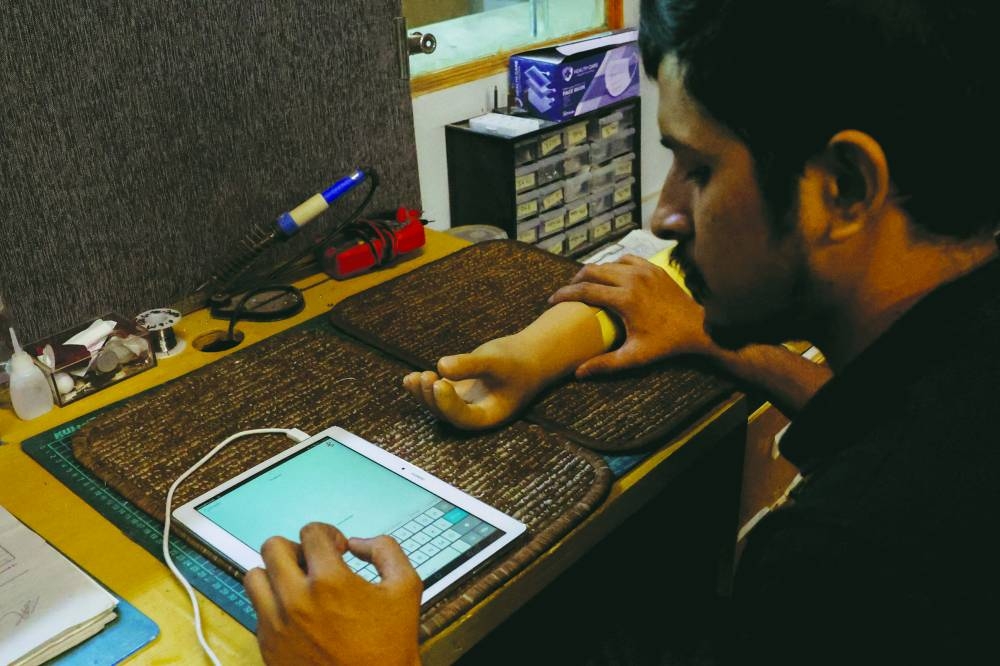 
A technician checks a prosthetic limb at Bioniks Private Limited, which also recently started providing prosthetics to Gaza conflict victims, in Karachi, Pakistan. (Reuters) 