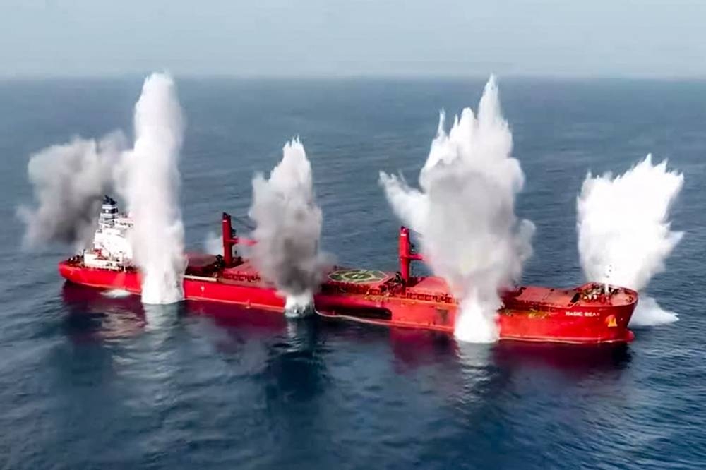 A view of explosions on the Liberia-flagged bulk carrier Magic Seas, which was attacked by Houthi-affiliated fighters at sea. AFP/HO/ Ansarullah Media Centre
