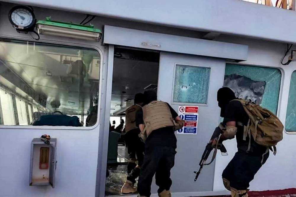 Houthi-affiliated fighters carrying out an attack on the Liberia-flagged bulk carrier Magic Seas at sea. AFP/HO/Ansarullah Media Centre