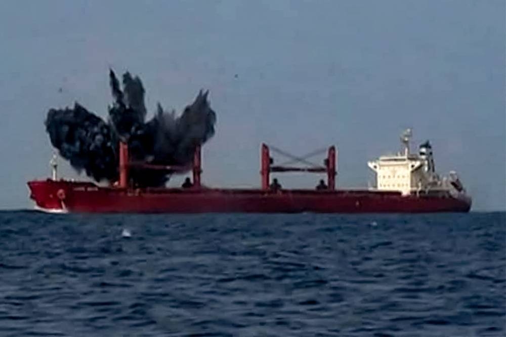 A view of explosions on the Liberia-flagged bulk carrier Magic Seas, which was attacked by Houthi-affiliated fighters at sea. AFP/HO/Ansarullah Media Centre