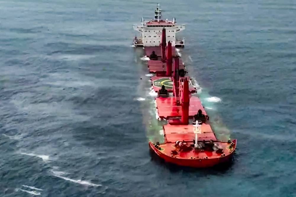 A view of the Liberia-flagged bulk carrier Magic Seas sinking, after it was attacked by Houthi-affiliated fighters at sea. AFP/HO/Ansarullah Media Centre