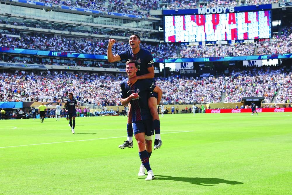 Paris St Germain's Fabian Ruiz celebrates scoring their third goal with Achraf Hakimi during their FIFA Club World Cup semi-final against Real Madrid at MetLife Stadium, East Rutherford, New Jersey, US, Wednesday. Reuters