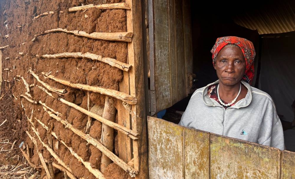 Mary Kibachia, 74, stands inside her mud-patched house before a Reuters interview about the impact of sweeping US foreign aid cuts that have left numerous water and sanitation projects incomplete, at Msengoni area in Kimorigo village, Taveta county, Kenya.