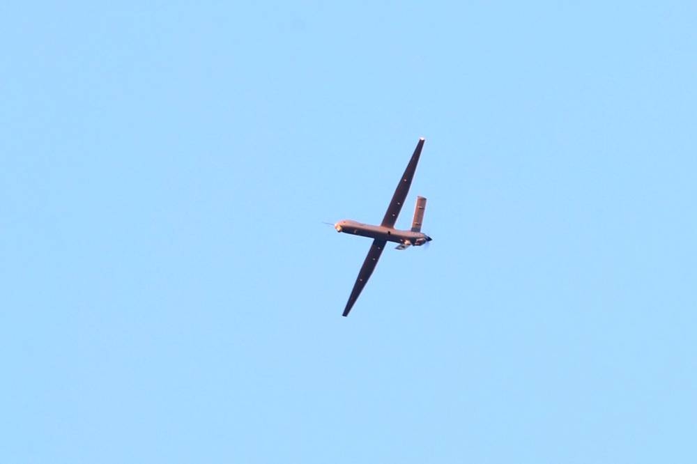 (FILES) A Turkish drone flies over the Turkish Aerospace Industries (TAI) building, after a huge explosion at the TAI headquarters, in Kahramankazan, some 40 kilometers (25 miles) north of Ankara on October 23, 2024. Low-cost technologies -- ubiquitous in current conflicts particularly in Ukraine -- and remotely piloted reconnaissance and strike aircraft are generating massive interest in Africa. Ethiopia and many other African nations are now turning to drones as a low-cost means of waging war with mixed military results but devastating consequences for civilian populations. (Photo by Adem ALTAN / AFP)