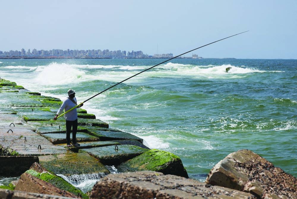 A view shows an Alexandrian citizen fishing on the corniche in the Mediterranean city of Alexandria, Egypt, April 20, 2025. REUTERS/Mohamed Abd El Ghany     TPX IMAGES OF THE DAY