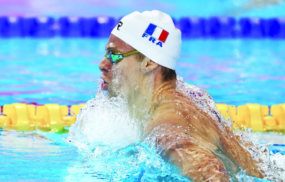 Swimming - World Aquatics Championships - Men 200m Medley Finals - World Aquatics Championships Arena, Singapore - July 31, 2025 France's Leon Marchand in action during the final REUTERS/Tingshu Wang