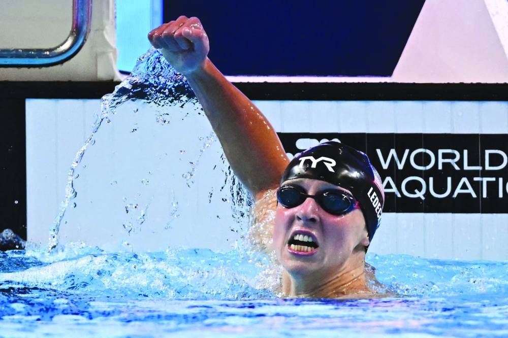 US' swimmer Katie Ledecky celebrates winning the final of the women's 800m freestyle swimming event during the 2025 World Aquatics Championships in Singapore on August 2, 2025. (Photo by MANAN VATSYAYANA / AFP)