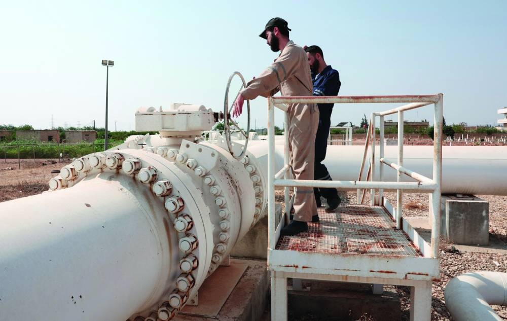 
Workers operate the pipelines with natural gas, coming from Turkiye and Azerbaijan, following the launch of natural gas exports to Syria, in Aleppo, Syria. – Reuters 