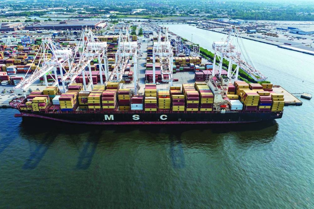 An aerial view of a cargo ship being loaded with shipping containers at the Port of Baltimore in Baltimore, Maryland, on Thursday. (AFP)