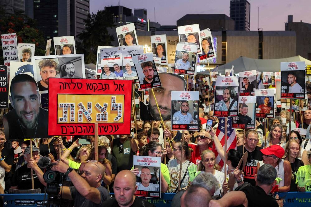 Protesters gather in a demonstration organised by the families of the Israeli hostages taken captive in the Gaza Strip since the October 2023 calling for action to secure their release in the plaza outside the Tel Aviv Museum of Art, known as the "Hostages' Square", in Tel Aviv on Saturday. AFP