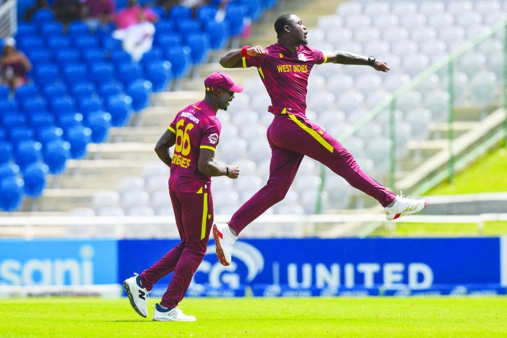 
Jayden Seales (right) of West Indies celebrates the dismissal of Mohammad Rizwan of Pakistan during the 3rd and final ODI at Brian Lara Cricket Academy in Tarouba, Trinidad and Tobago. (AFP) 