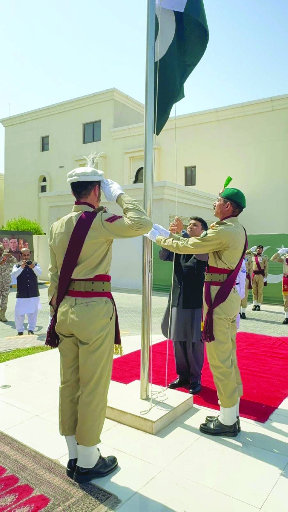 Chargé d’Affaires Syed Mustafa Rabbani hoisting the Pakistan flag.