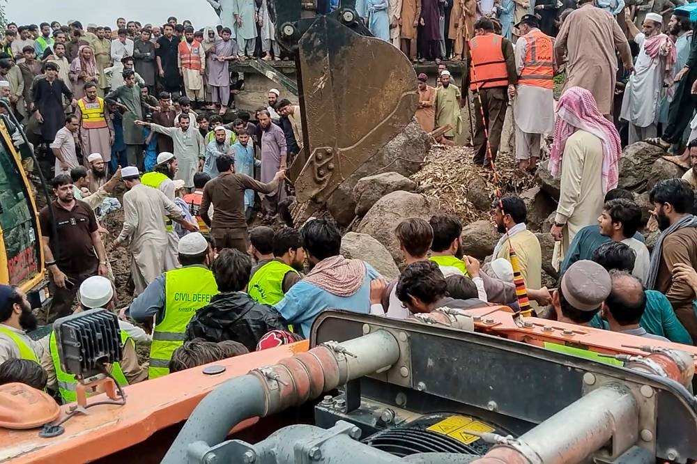 Rescuers search for victims at the site of a flashflood in Salarzai Tehsil of Pakistan's Bajaur district, on Friday. AFP