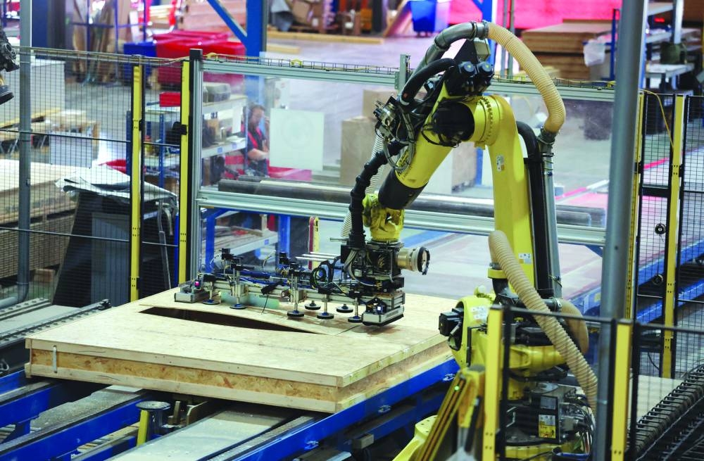 
Robotics build timber frame panelling to be assembled later at a home construction site, at Donaldson Timber Systems in Witney, Britain. 